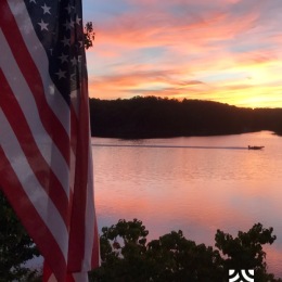 flag with lake in background