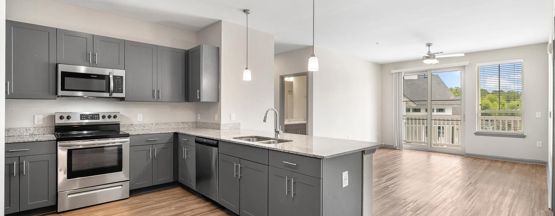 a kitchen with black cabinets