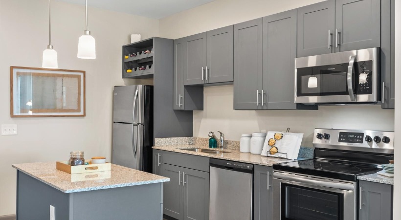 a kitchen with black cabinets