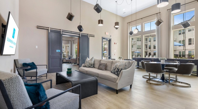 a living room with a tv and couches